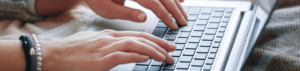 Woman Typing on a Computer Keyboard